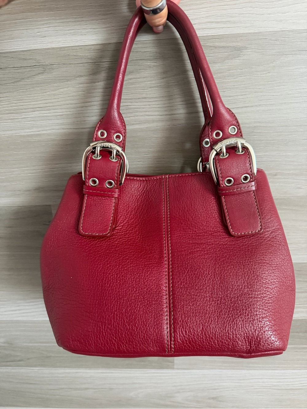 Tignanello Red Pebbled Leather Handbag with Silver Buckle
Accents